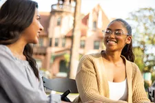 two students smiling