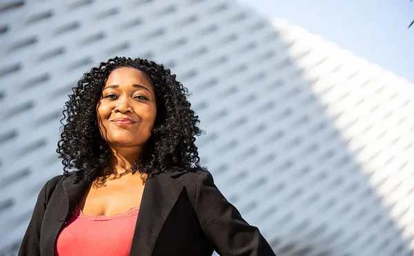 A student looking confidently at the camera.