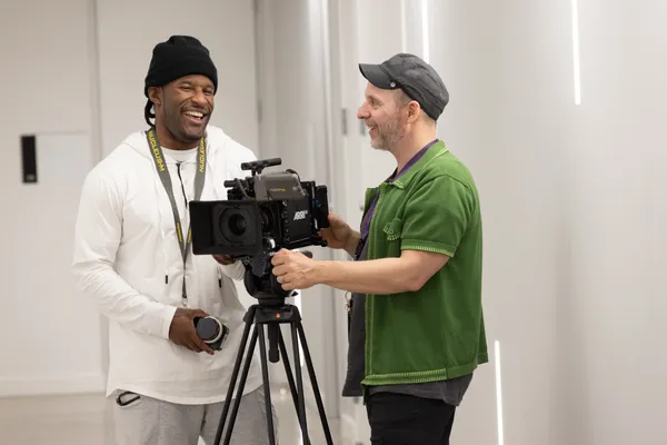 two men using camera