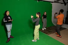 students photographing using green screen