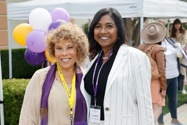 two alumnae smiling at an msmu event