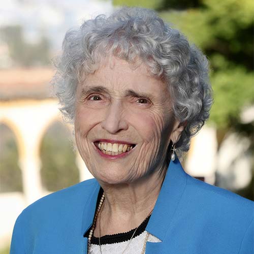 Woman smiling wearing a blue jacket outside of MSMU Chalon Campus