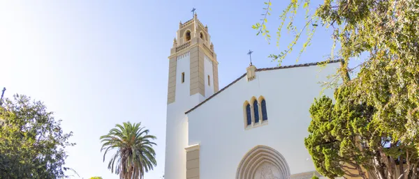 An image taken looking up at a chapel and tower behind it on MSMUs Chalon campus