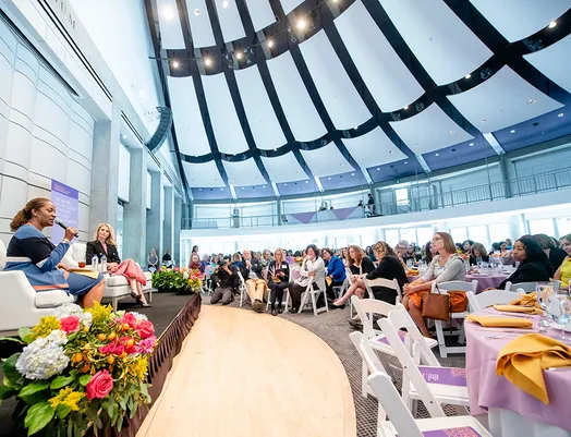 event picture of speakers on stage and listening audience