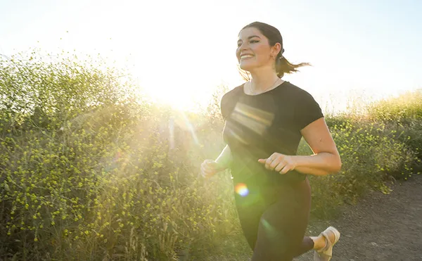 Woman running outside.