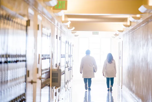 Nursing students walking down a hallway