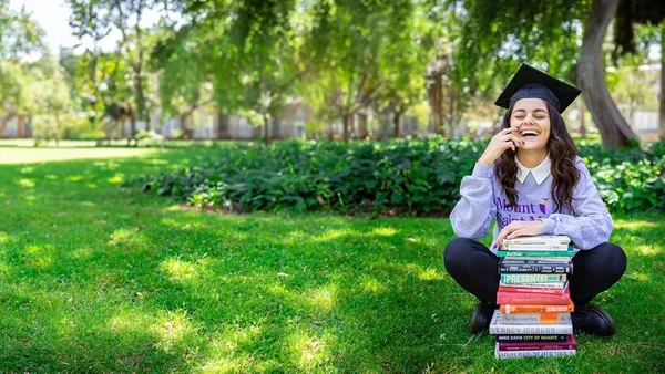 Student seating in front of book at the Doheny Campus