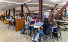 Students sitting and studying together at the Doheny Library.