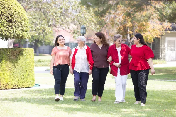 Students walking with two CSJs at the Doheny Campus