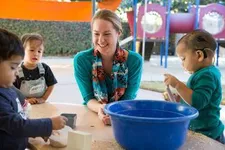 Teacher playing with children