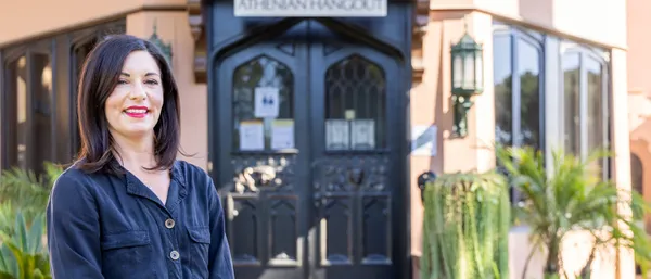 female adult student smiling on campus