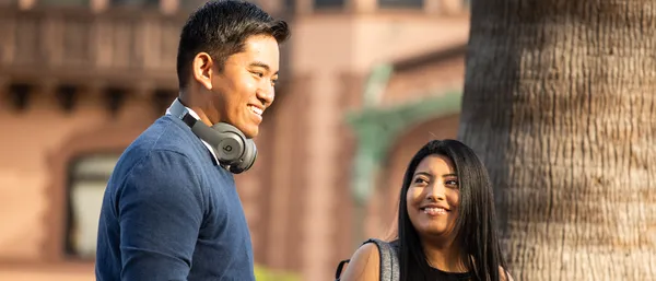 Two students smiling