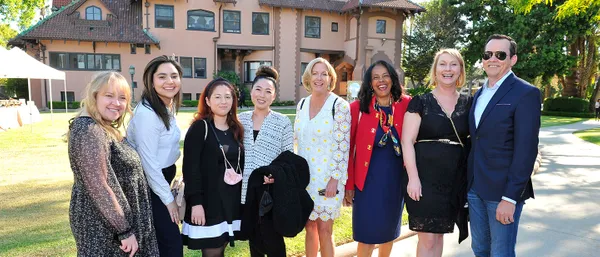 group of faculty and staff smiling together