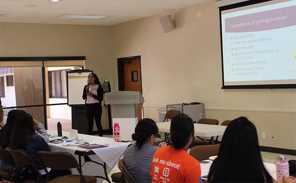 Students listening to a lecture in a classroom.