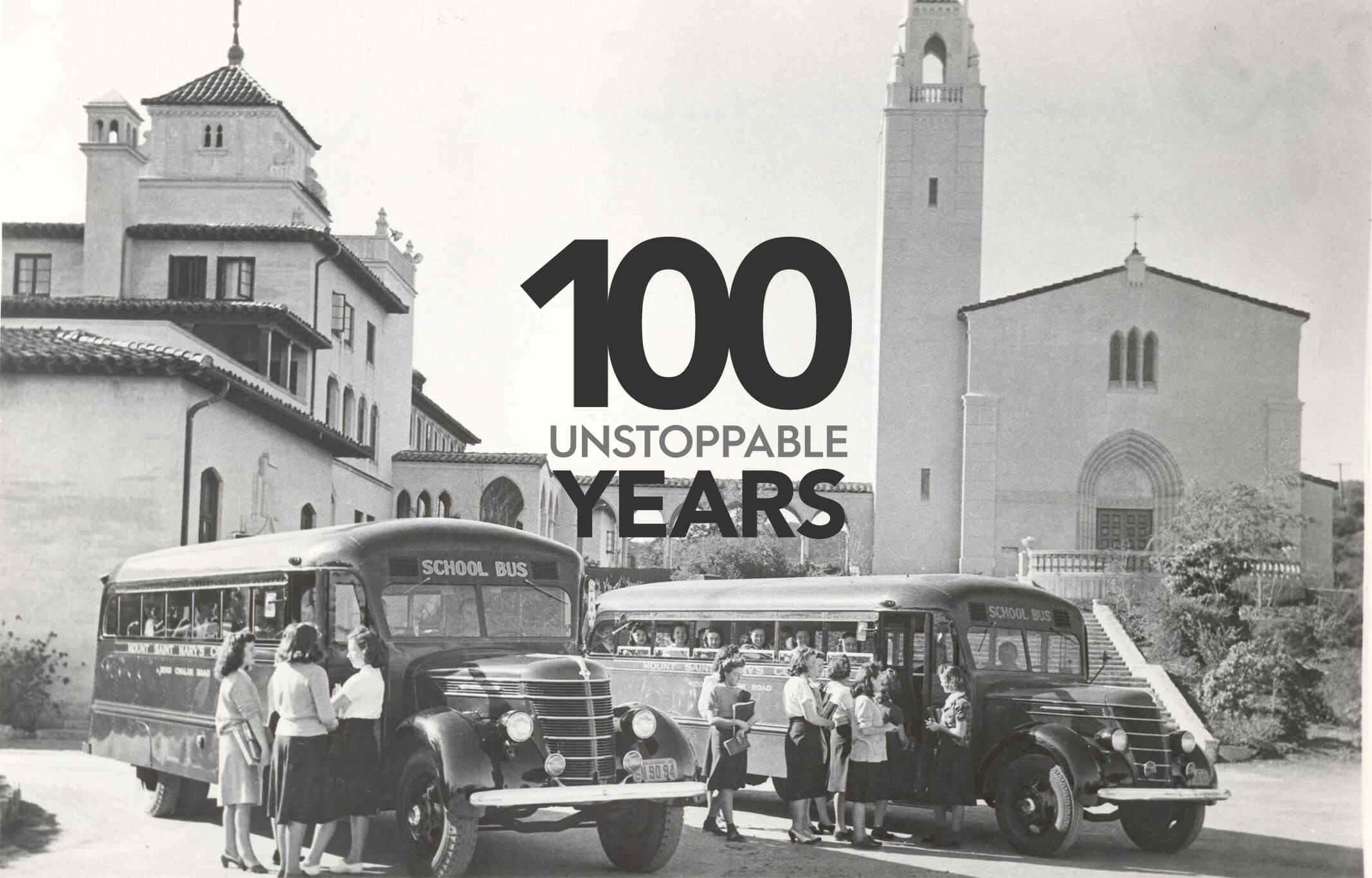 black and white students getting off a bus in MSMU Chalon campus courtyard in 1930