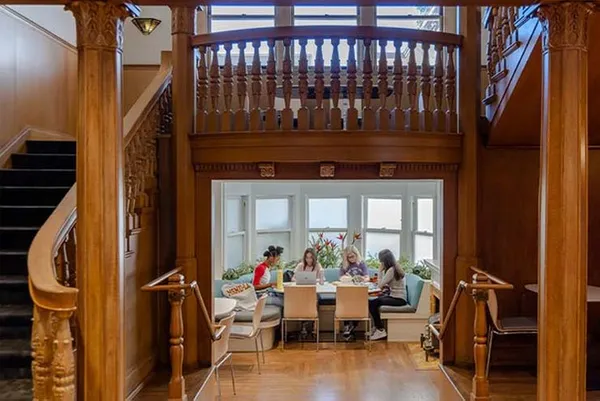 students working indoors at a table