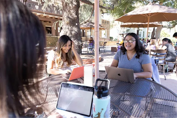 Students sitting on patio