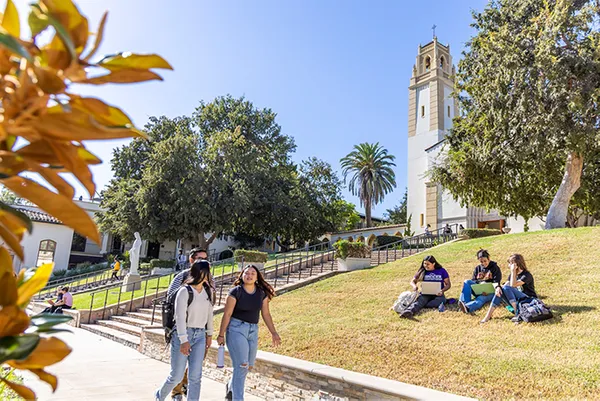 students walking in front of chalon stairs